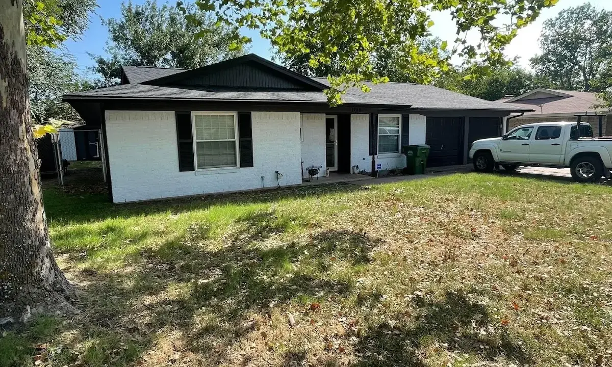 Professional roofing crew working on a residential roof in Gloucester